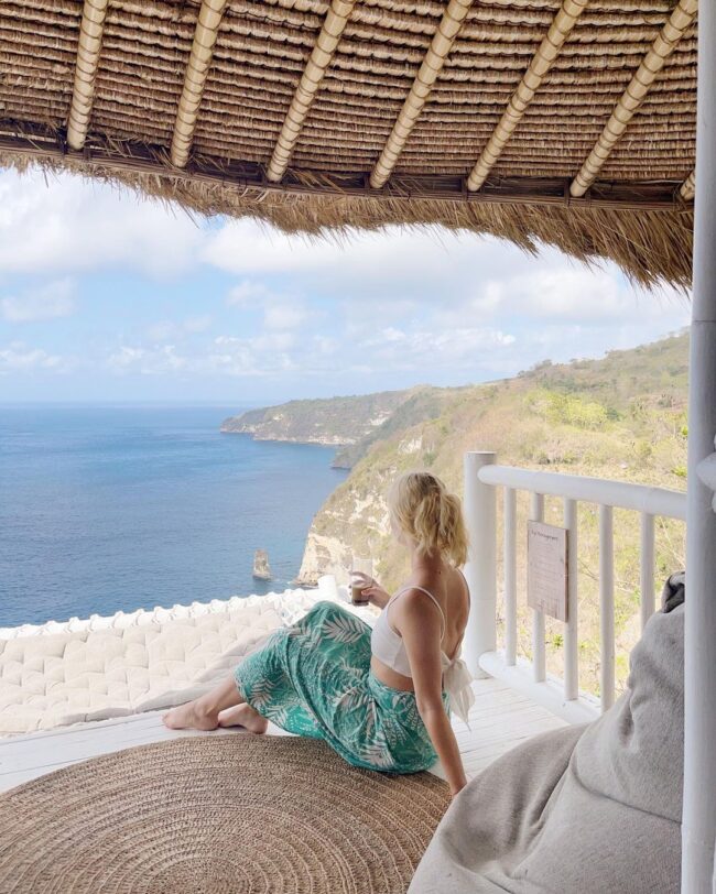 Lying on the terrace of the Tropical Glamping's bungalow
